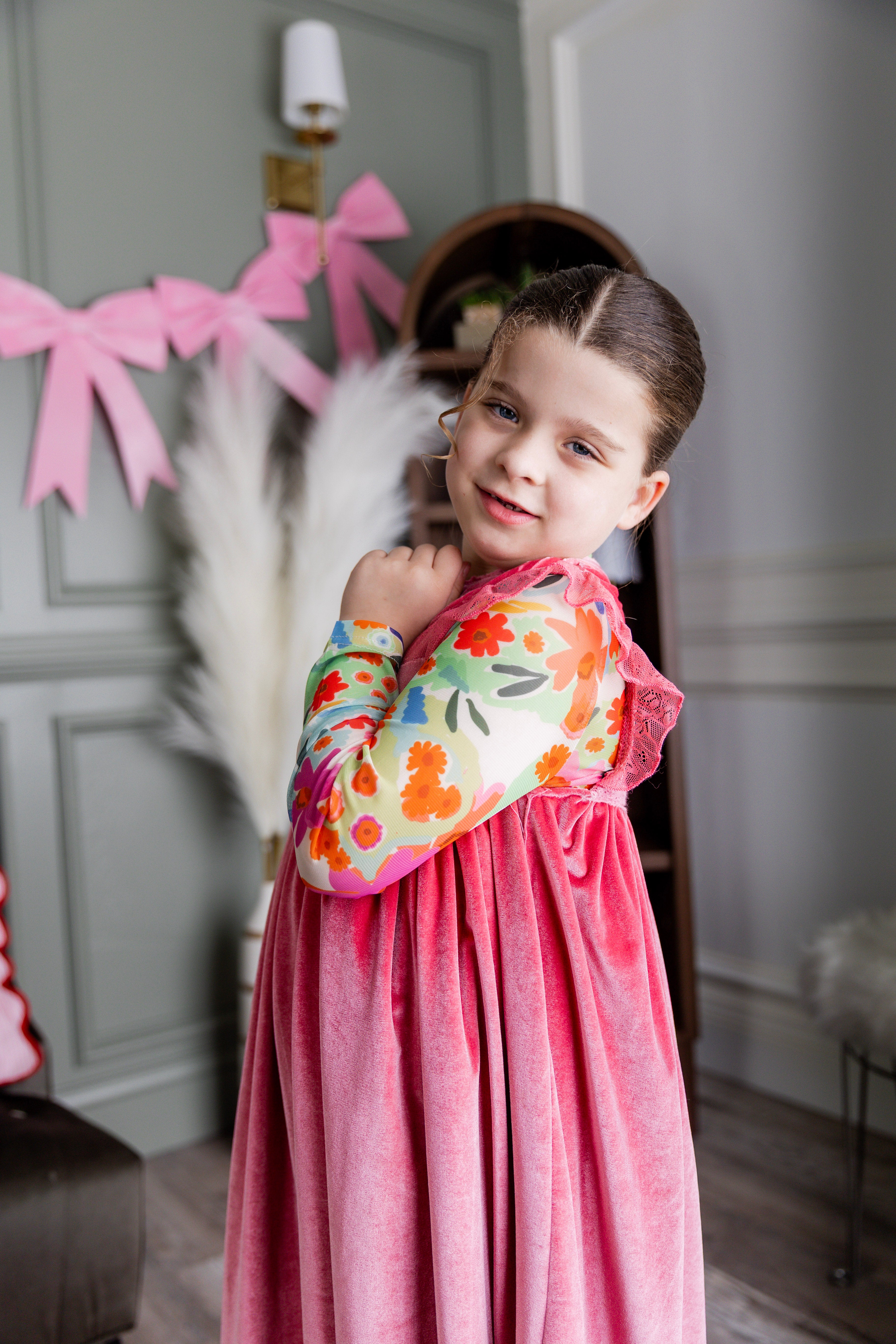 Model wearing Nuggles® Girls' Mesh Tee in Confetti Bloom