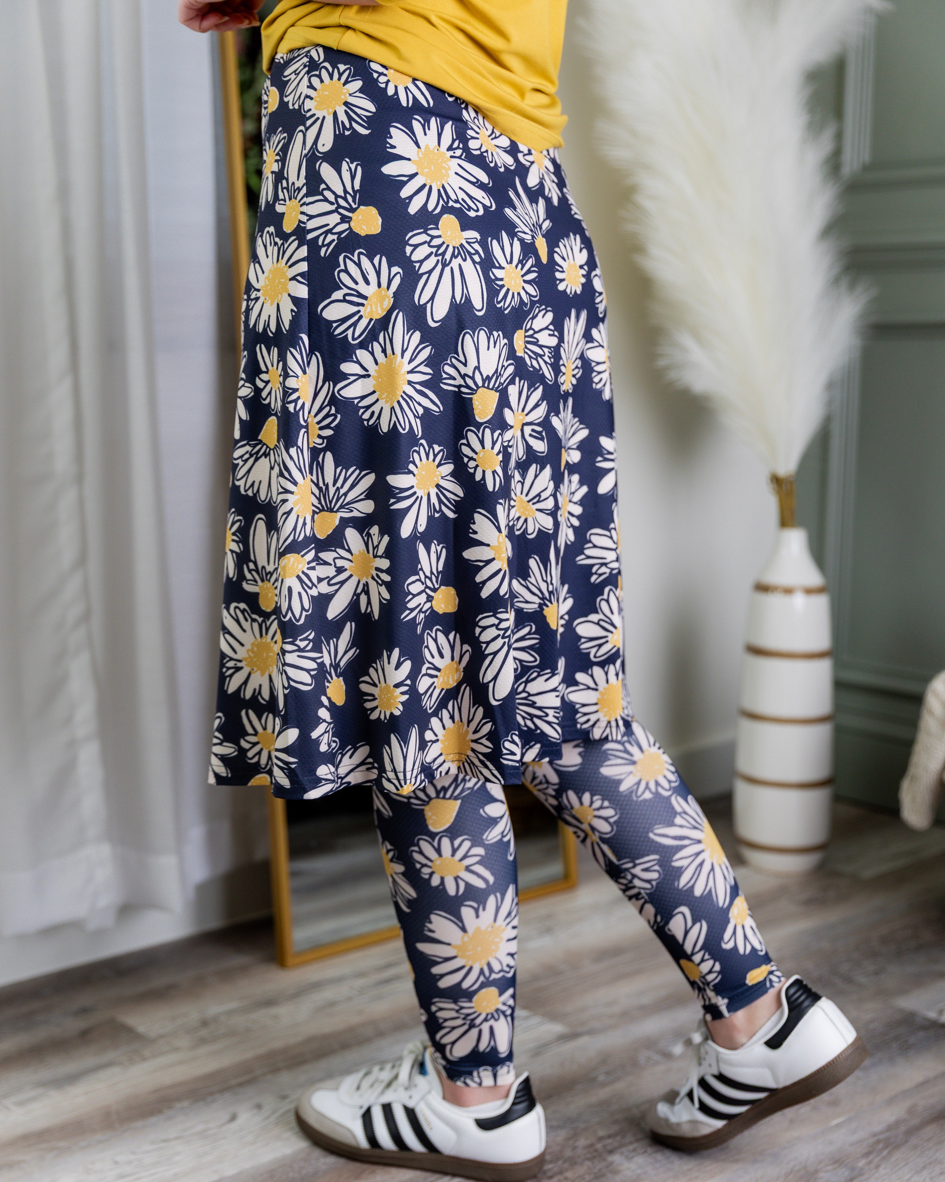 Model wearing Nuggles® Tilly Sport Skirt in Daisy After Dark