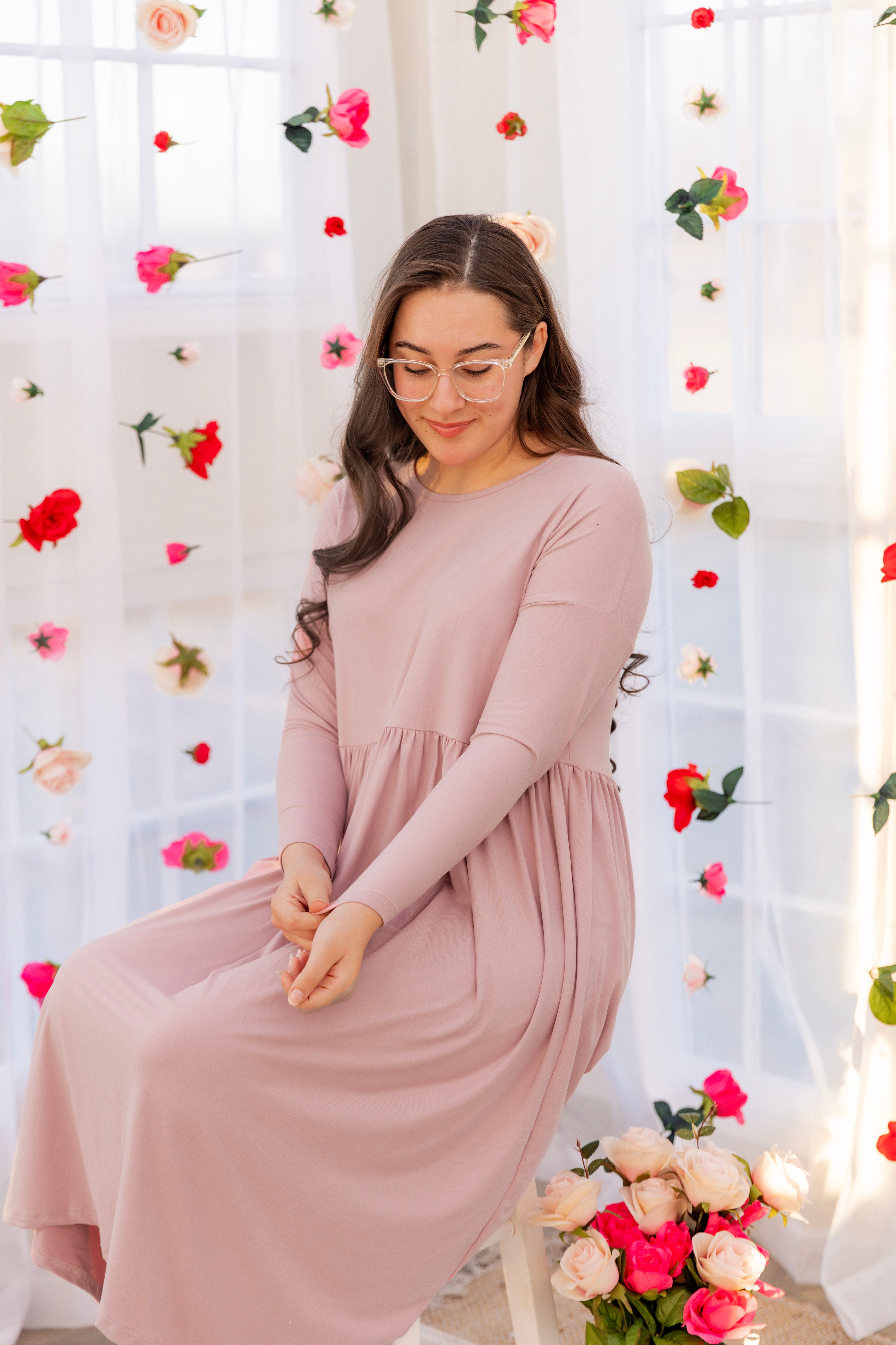 Model wearing the Nuggles® Farah Dress in Baby Pink