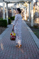 Modest high and low dress with ruffle sleeves and contrasting prints