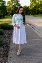 modest long sleeve top with a tie knot and contrasting knit fabrics