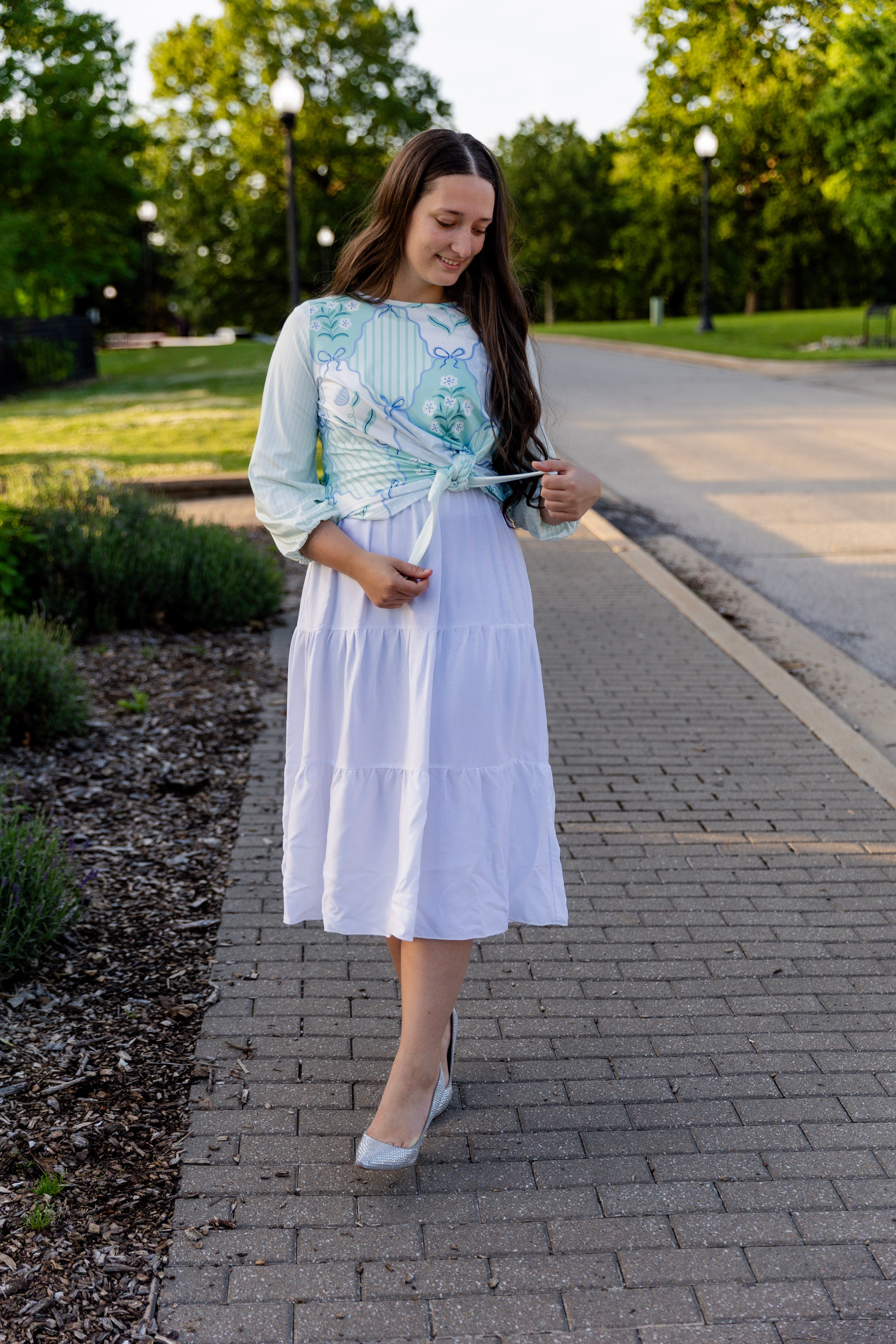 modest long sleeve top with a tie knot and contrasting knit fabrics