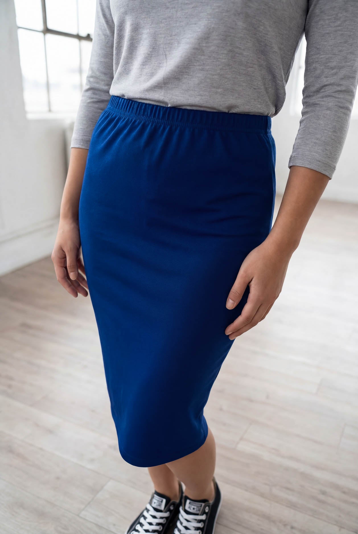 Model wearing Nuggles® 25" Classic Skirt in Dark Royal