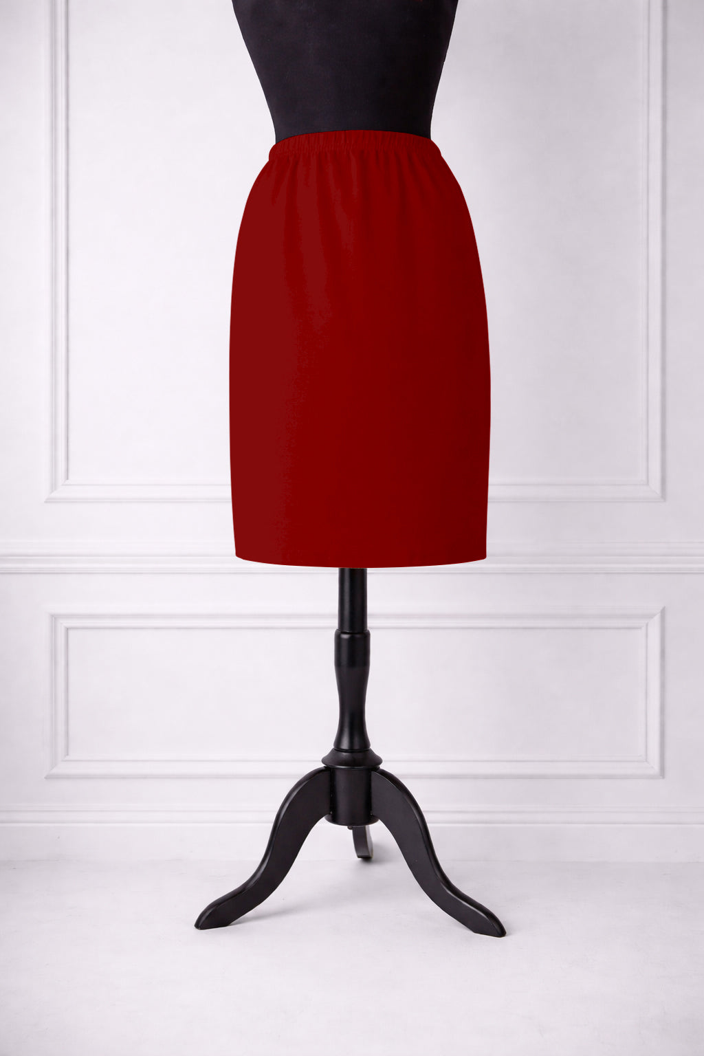 Stock photo of our Nuggles® 25-inch classic skirt elastic waistband and straight silhouette in Brick Red