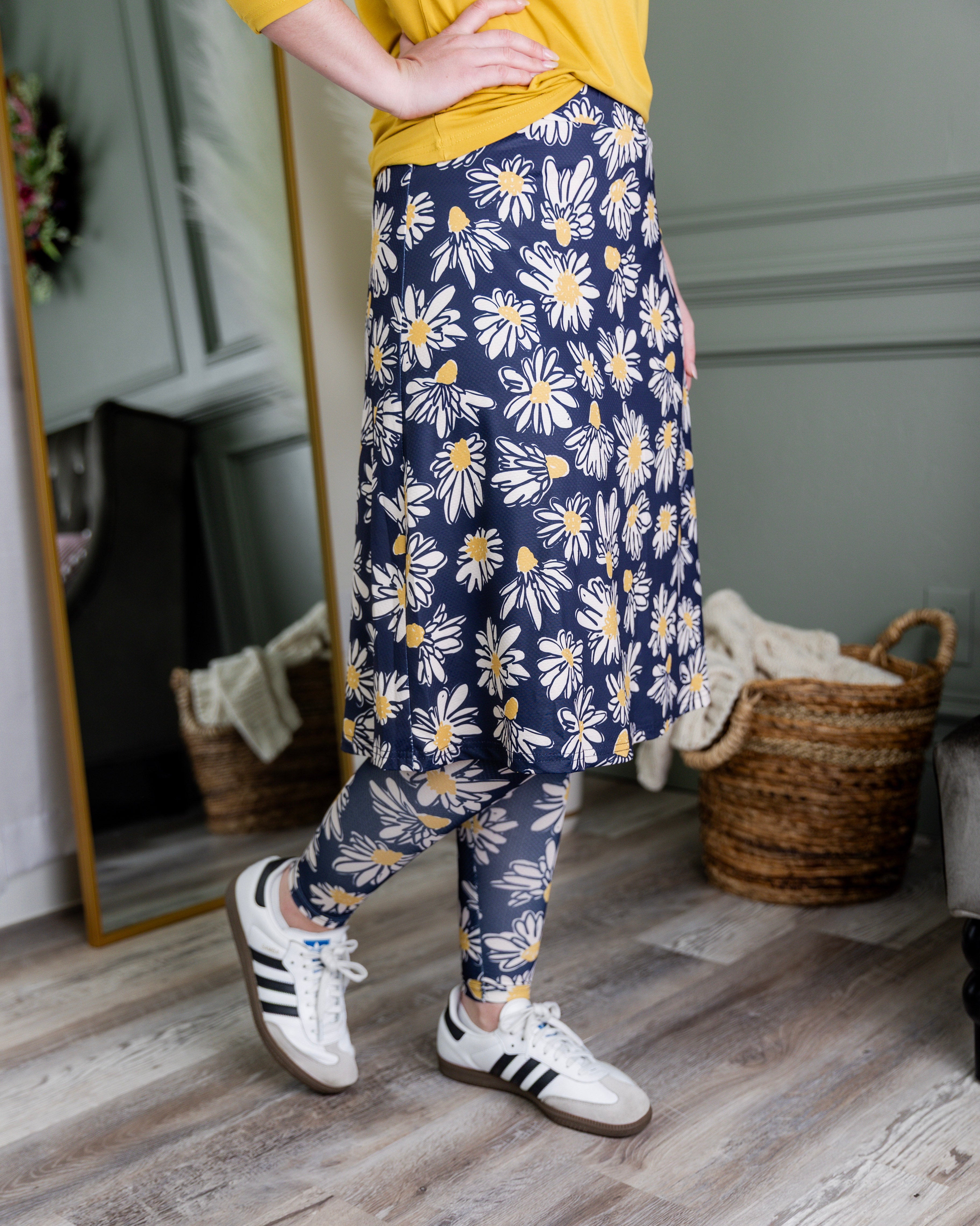 Model wearing Nuggles® Tilly Sport Skirt in Daisy After Dark