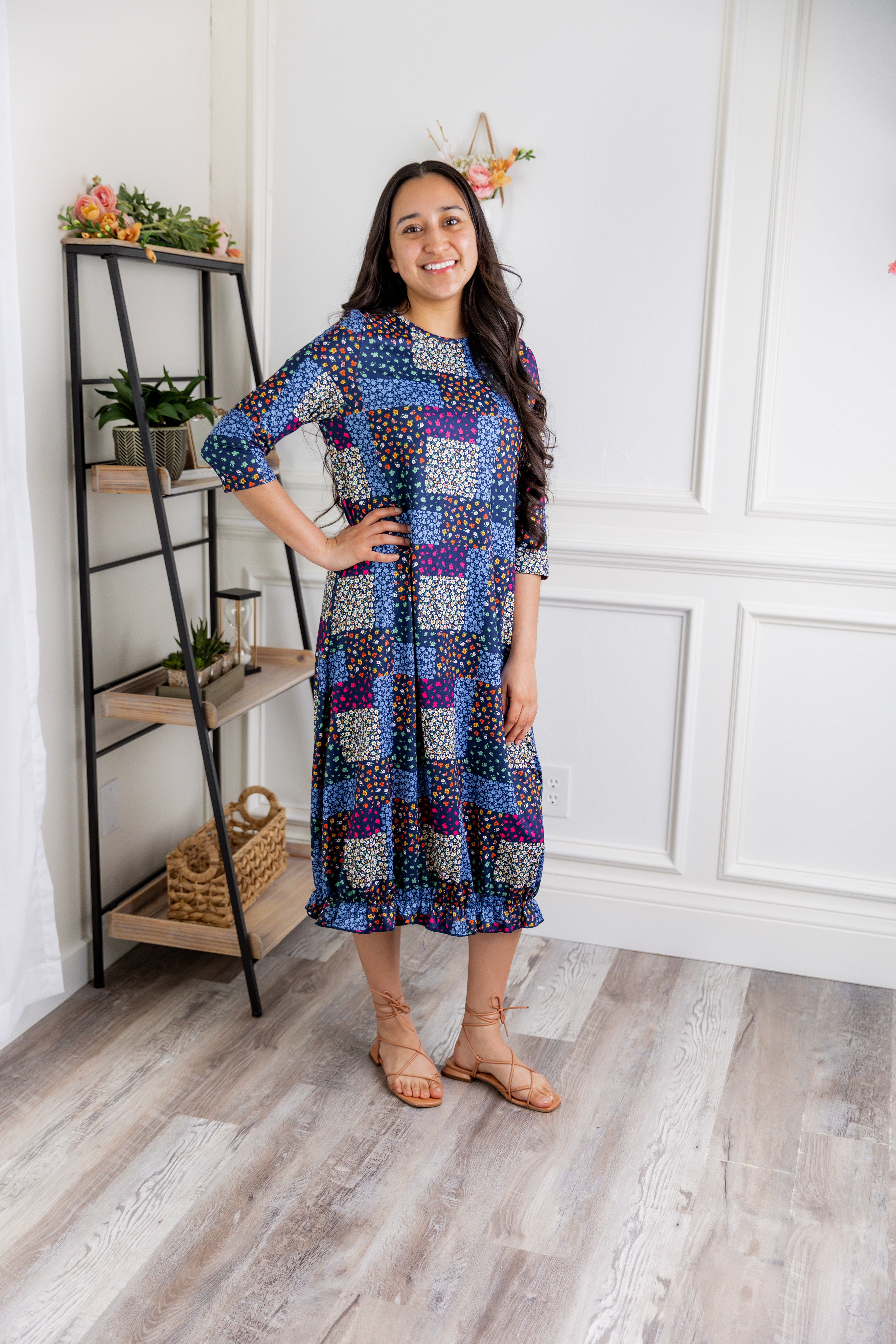 Model wearing our Nuggles® modest Bristol midi dress with 3/4 sleeves and elastic ruffle hem in various prints.