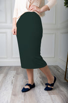 Modest midi skirt in soft knit fabric with a tapered hem and stretch waistband, shown in a classic neutral. A Nuggles favorite in 27", 31", and 34" lengths.