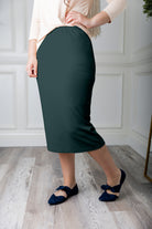 Modest midi skirt in soft knit fabric with a tapered hem and stretch waistband, shown in a classic neutral. A Nuggles favorite in 27", 31", and 34" lengths.