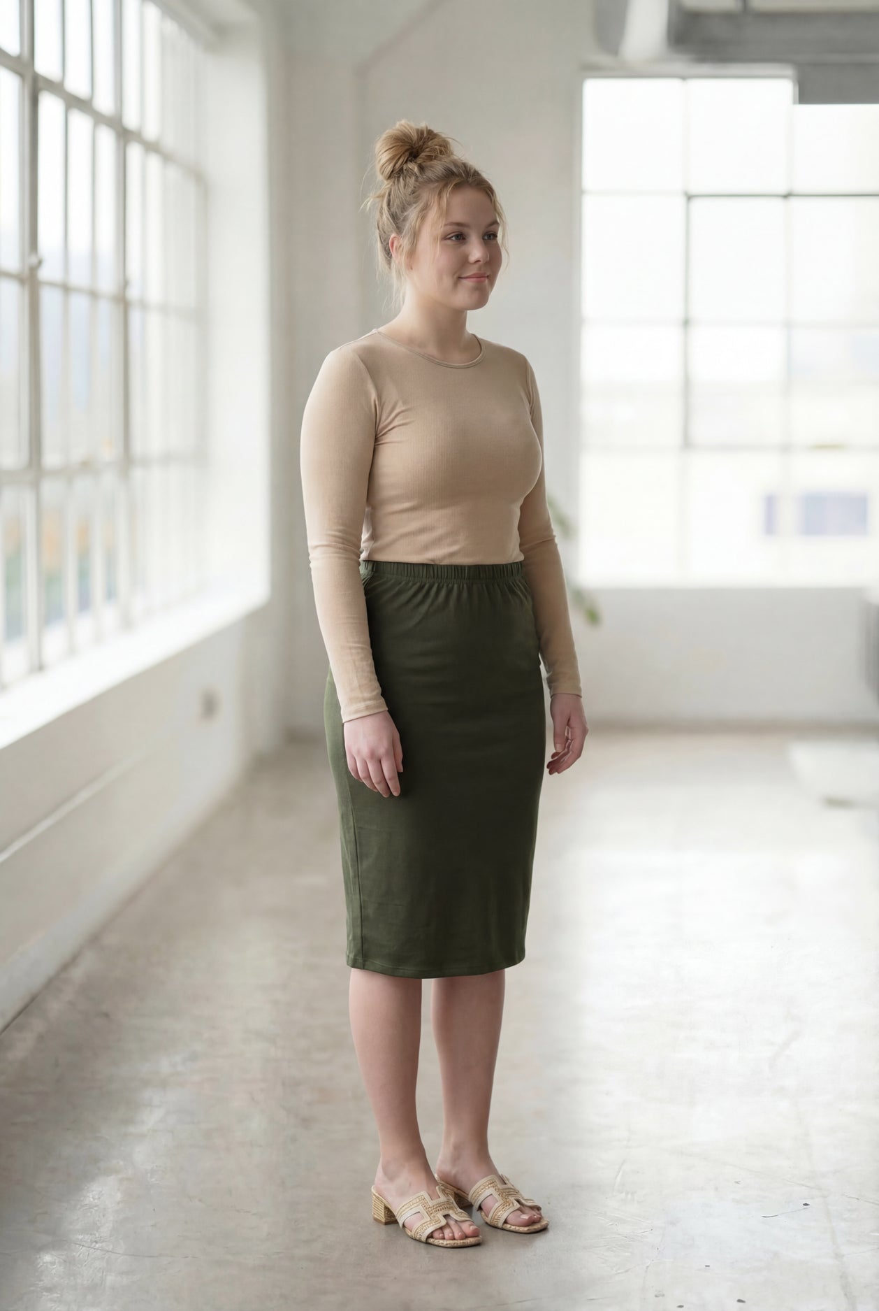 Model wearing Nuggles®  27" Classic Skirt in Olive Green
