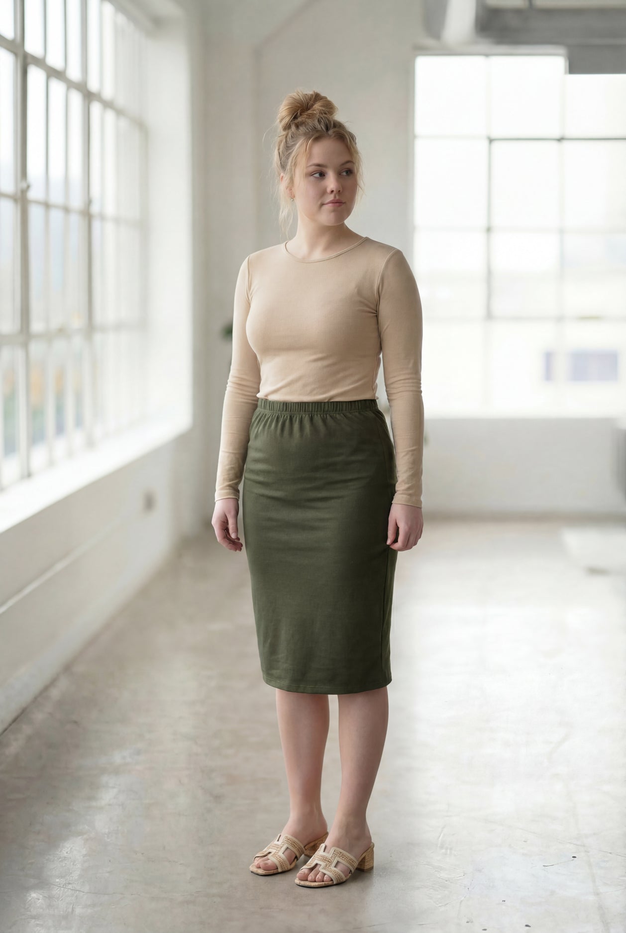 Model wearing Nuggles®  27" Classic Skirt in Olive Green
