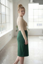 Model wearing Nuggles®  27" Classic Skirt in Pine Green
