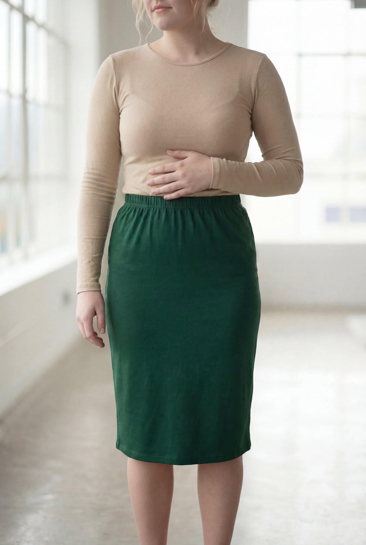 Model wearing Nuggles®  27" Classic Skirt in Pine Green
