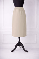 Stock photo of our Nuggles® 27-inch classic skirt elastic waistband and straight silhouette in Nude