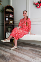 Model wearing Nuggles® Cindy Bubble Dress in Berry Maze