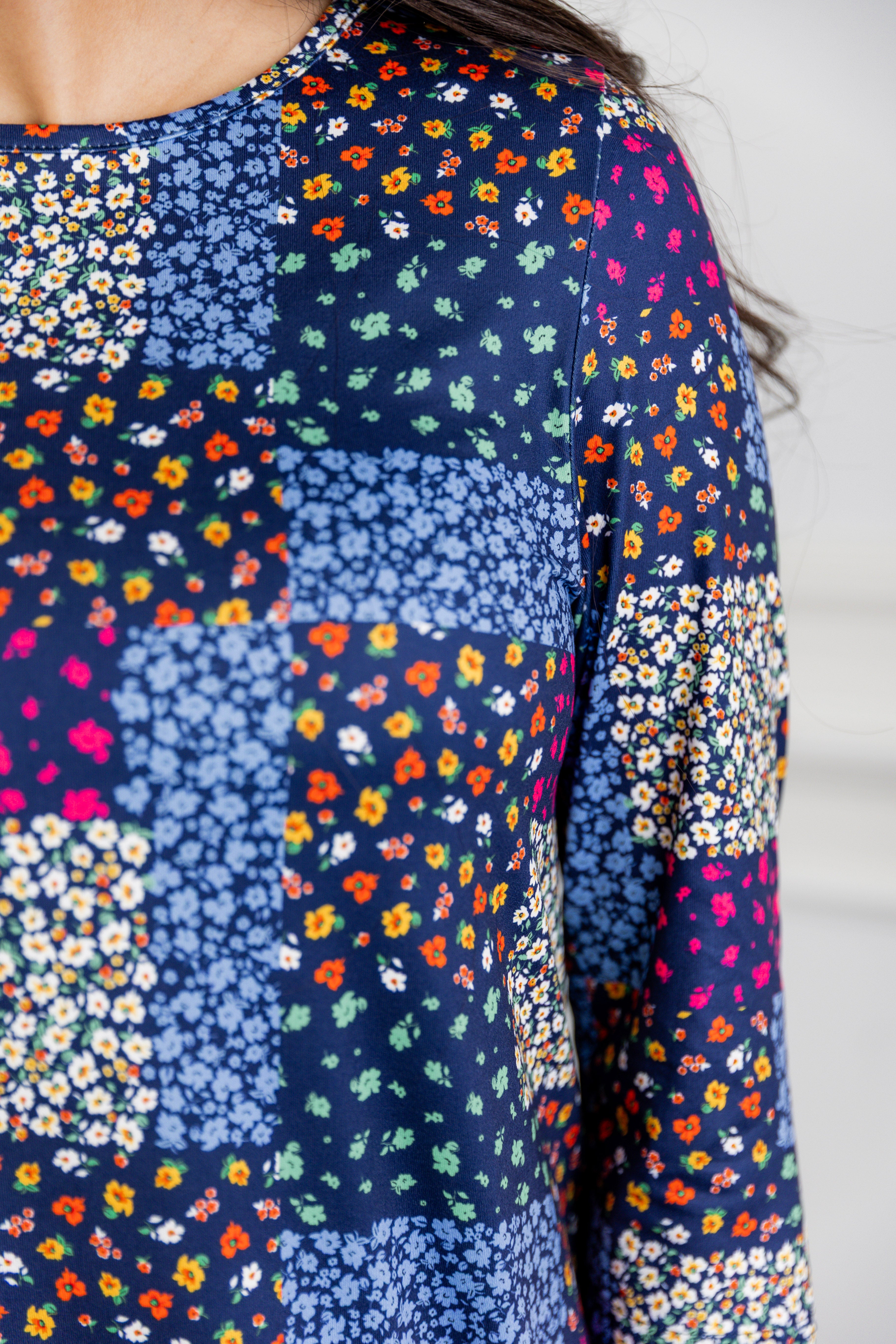 Model wearing our Nuggles® modest Bristol midi dress with 3/4 sleeves and elastic ruffle hem in various prints.