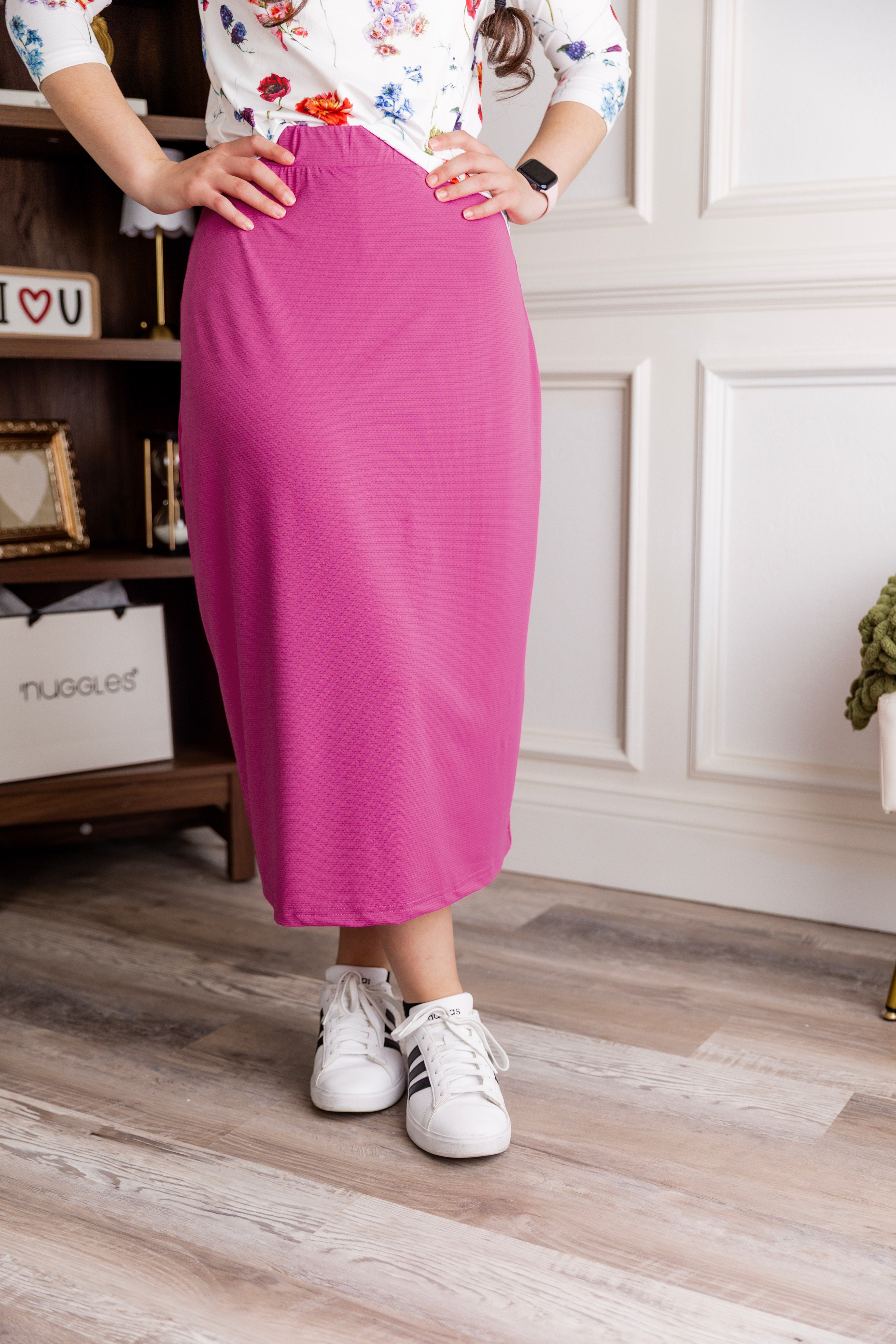 Model wearing Nuggles® 31" All-Sport Skirt in Hot Pink