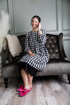 Model wearing our modest Nuggles® 27" crochet lace slip in Black