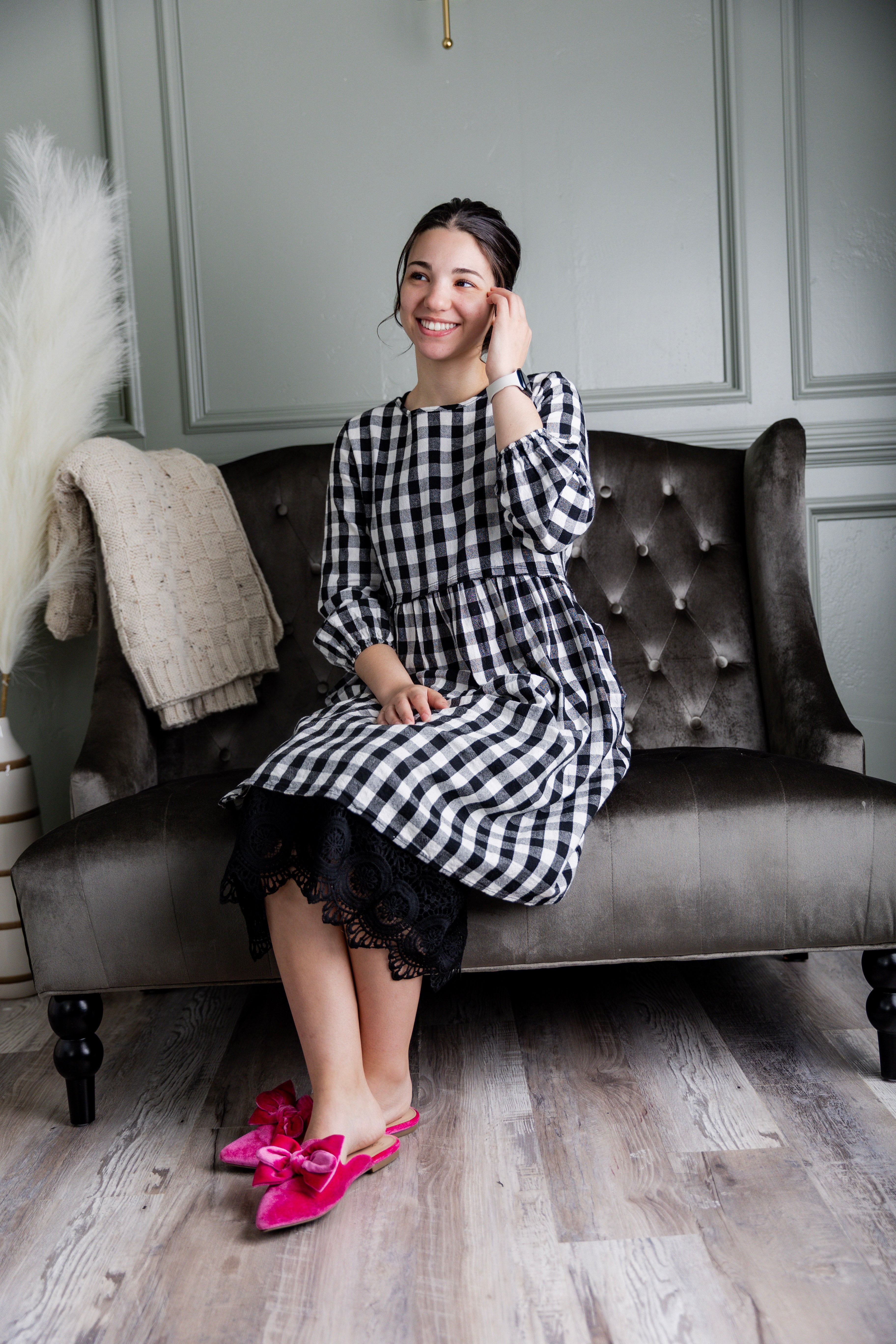 Model wearing our modest Nuggles® 27" crochet lace slip in Black