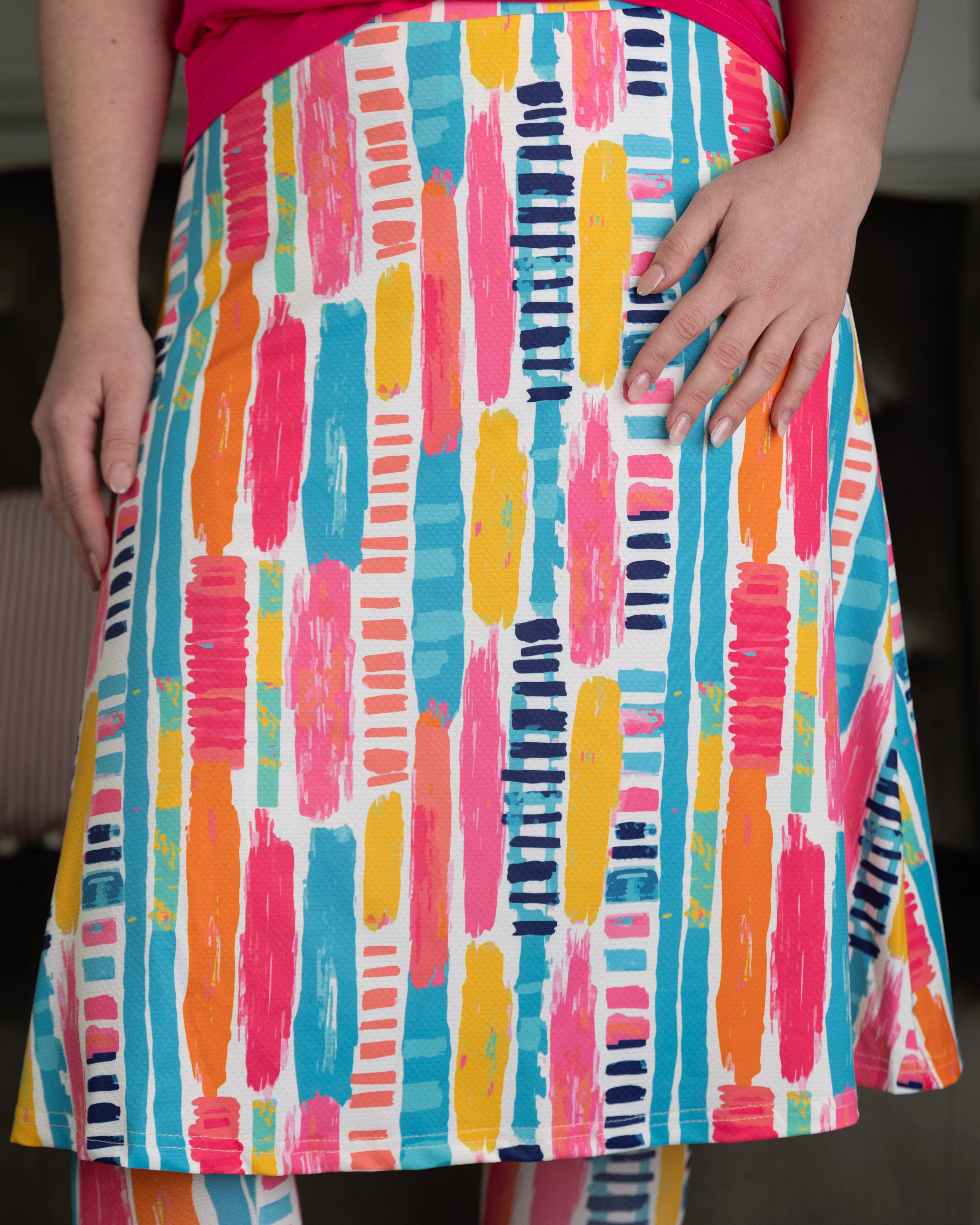 Model wearing Nuggles® Tilly Sport Skirt in Color Splash