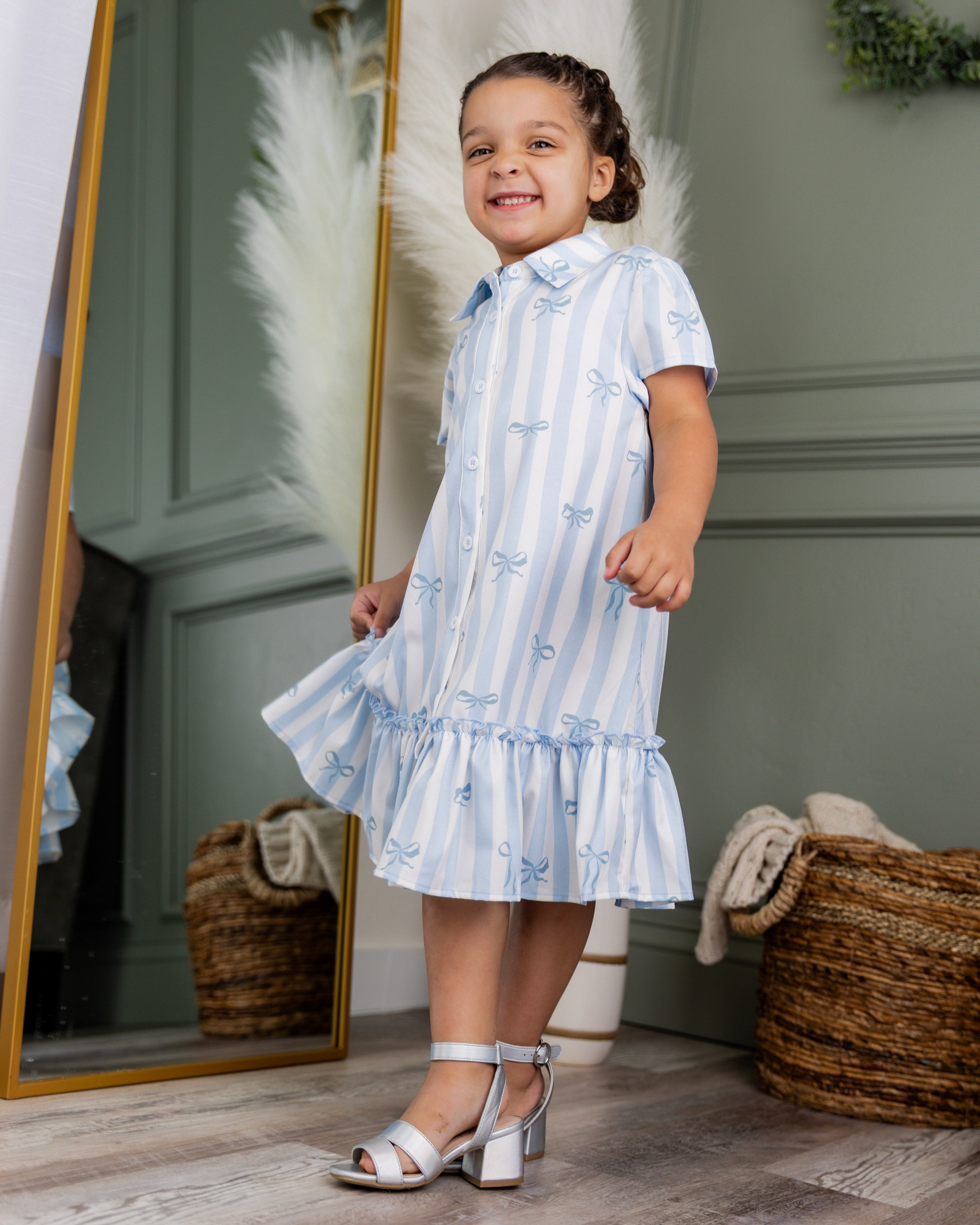 Model wearing Nuggles® Girls' Ellie Dress Dress in Sweet Ribbon Stripe
