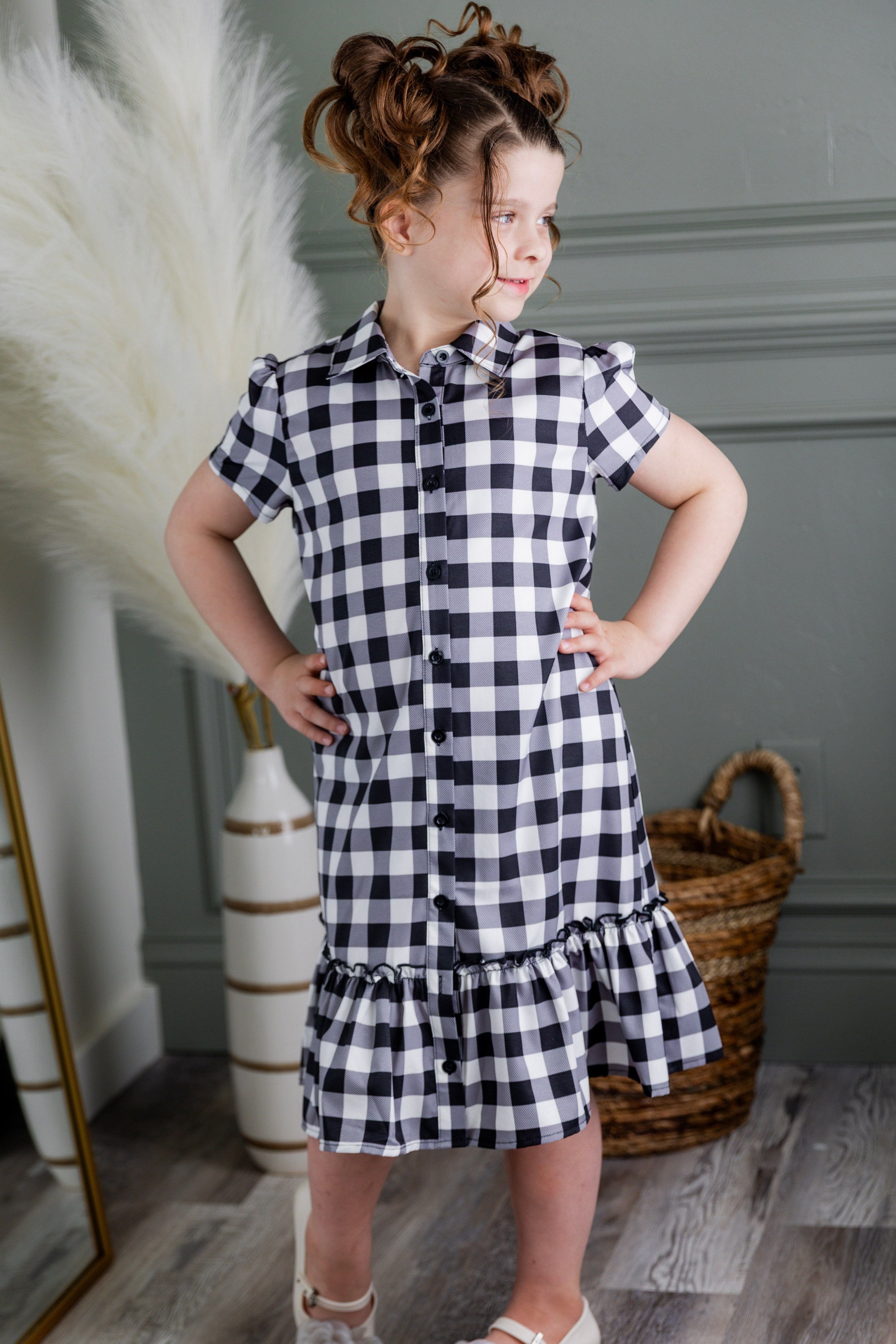 Model wearing Nuggles® Girls' Ellie Dress Dress in Storybook Check