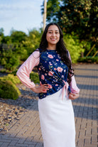 modest long sleeve top with a tie knot and contrasting knit fabrics