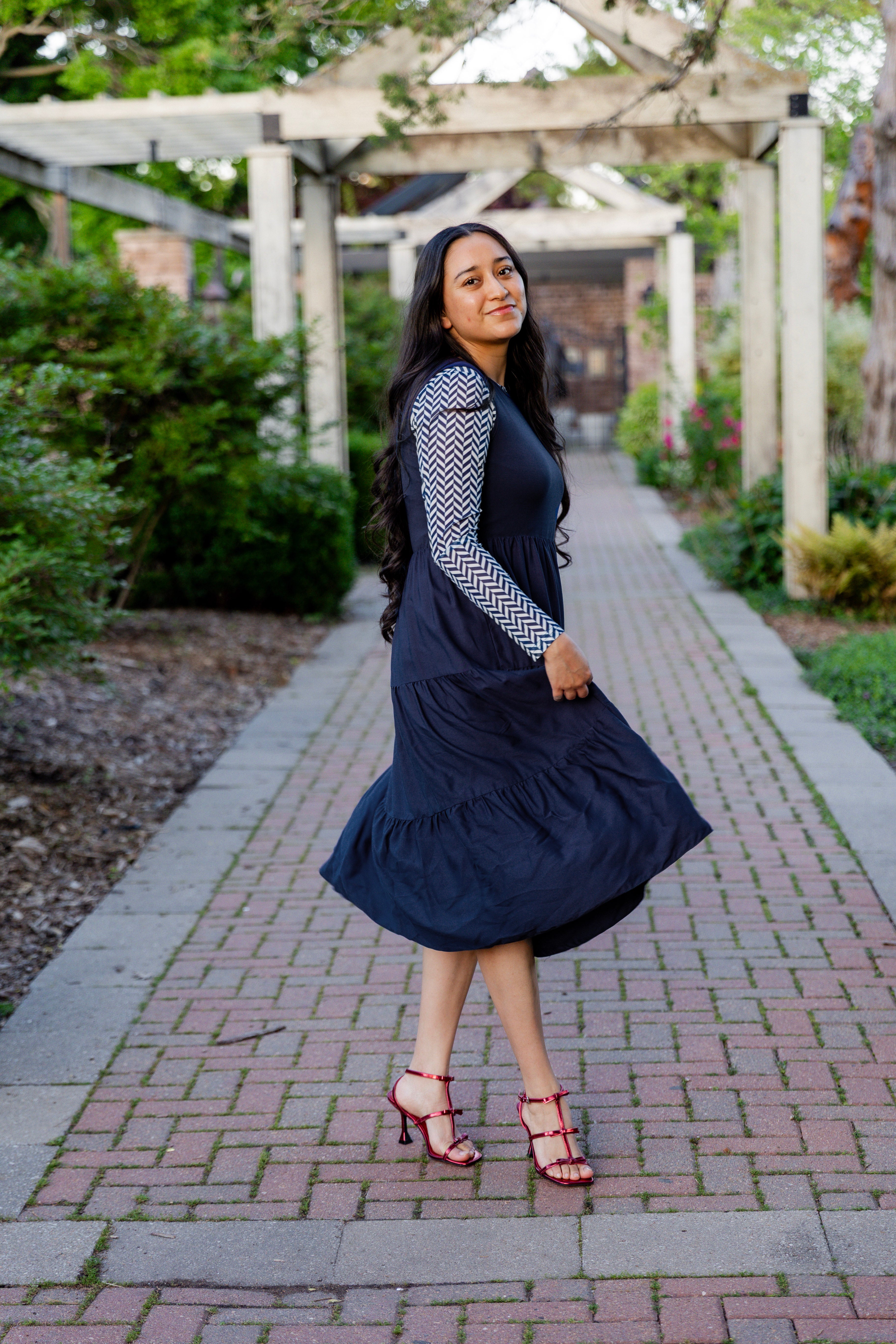 Modest sleeveless midi dress with tiered skirt and fitted bodice, styled for layering with a crew neckline – Hannah Layering Dress by Nuggles®.