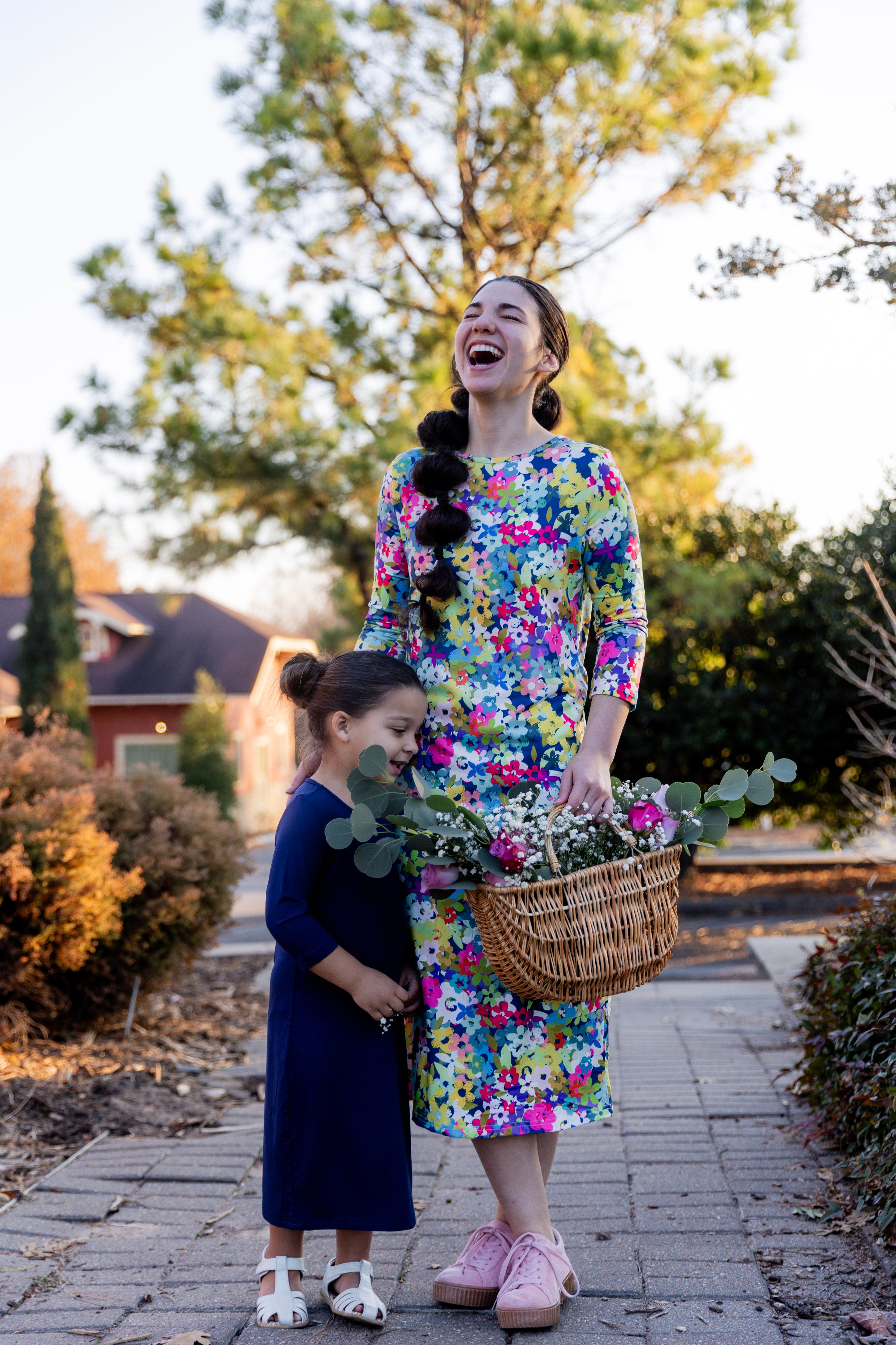 Model wearing the Nuggles® Original Midi Layering Dress in Wildflower Haze