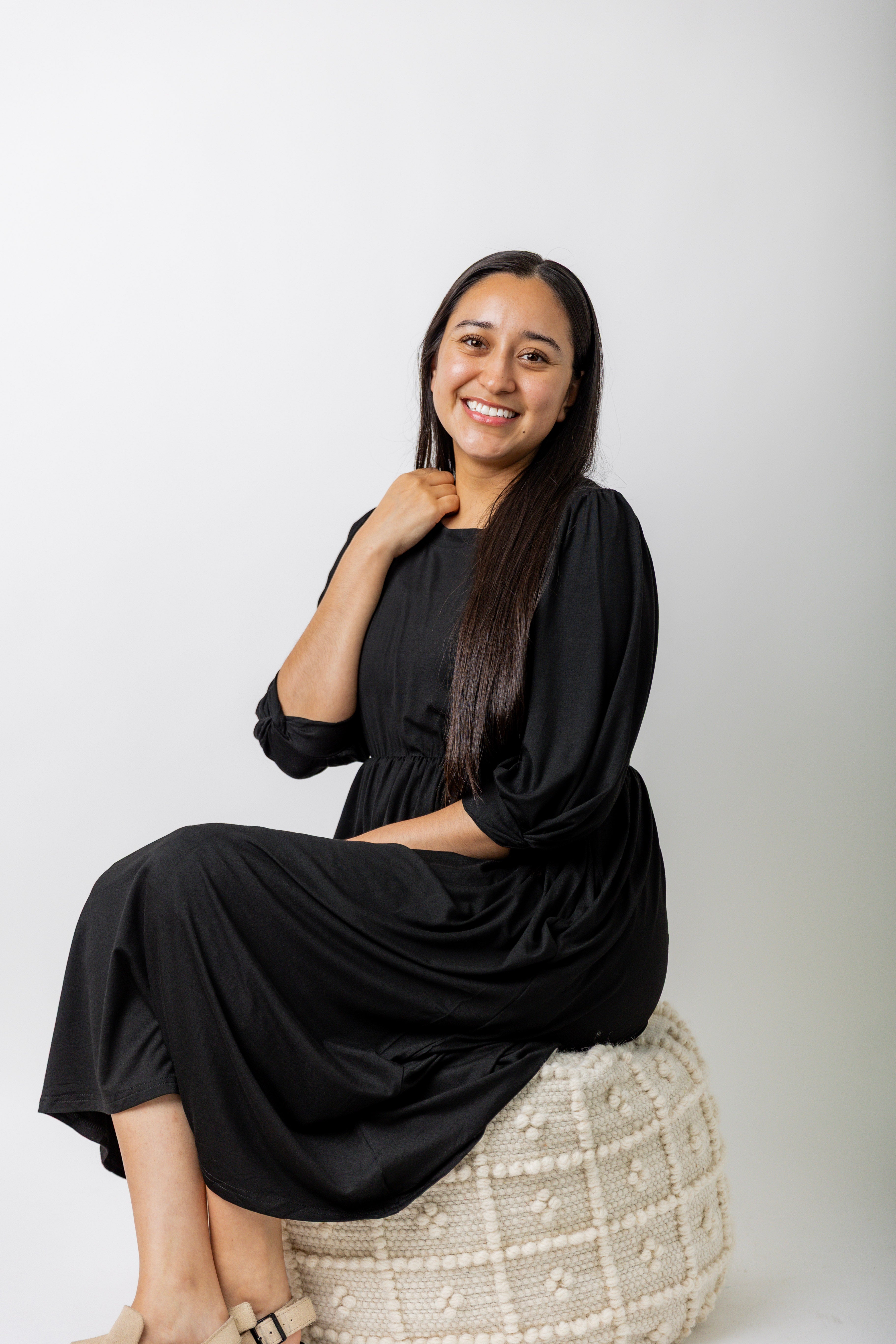 Modest Willow Solid Colors Dress by Nuggles® featuring a gathered waist, balloon sleeves, and side pockets; shown in various solid colors and angles for a stylish, comfortable everyday look.