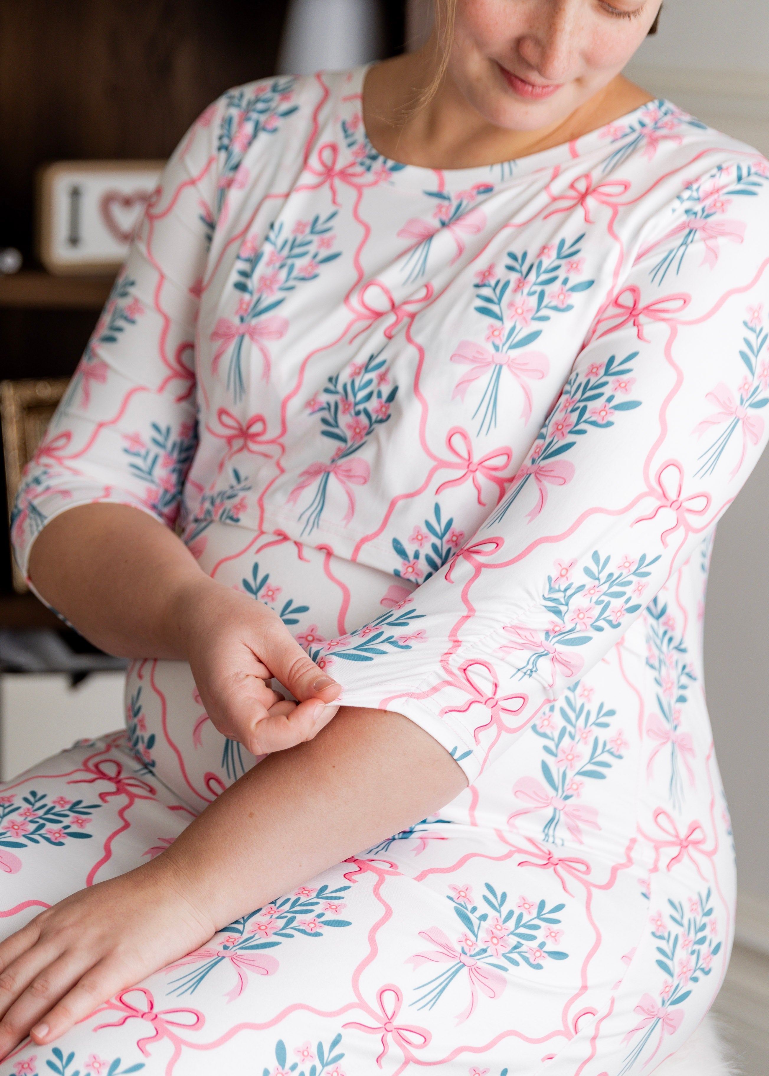 Model wearing Nuggles® Nalani Nursing Dress in Pixie Petals 