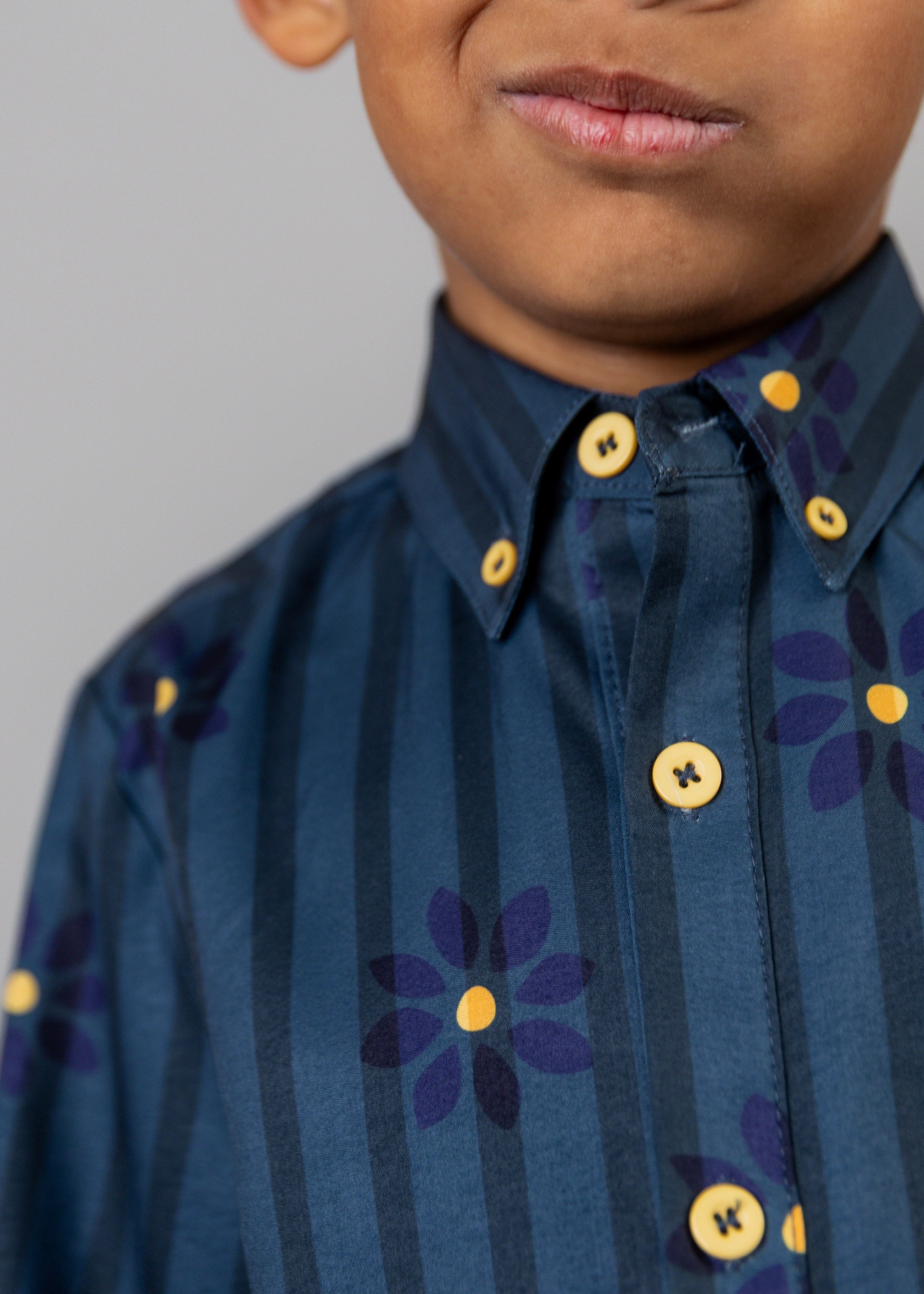 Model wearing Nuggles® Boy's Button Down Shirt in Pinstripe Ditsy