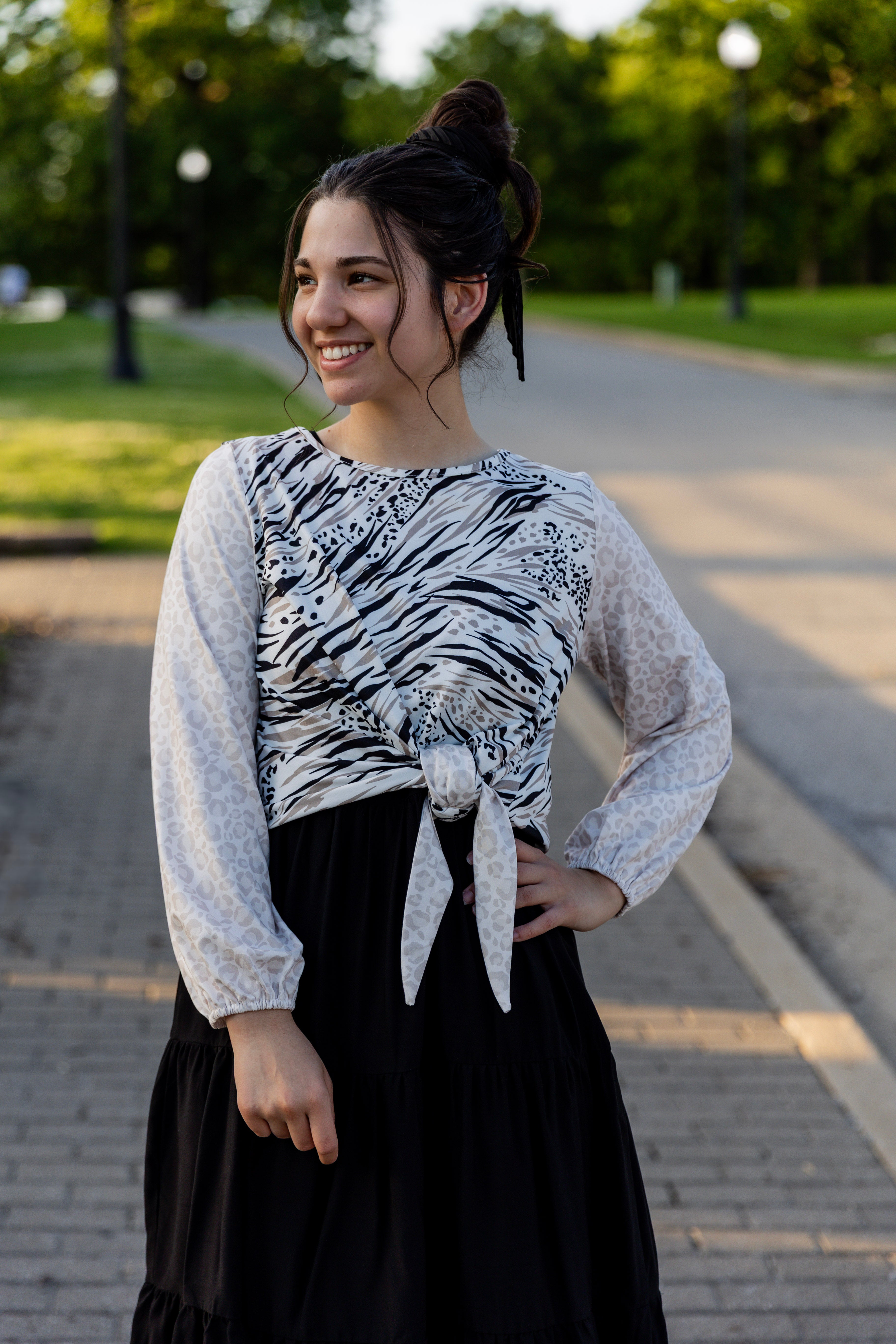 modest long sleeve top with a tie knot and contrasting knit fabrics
