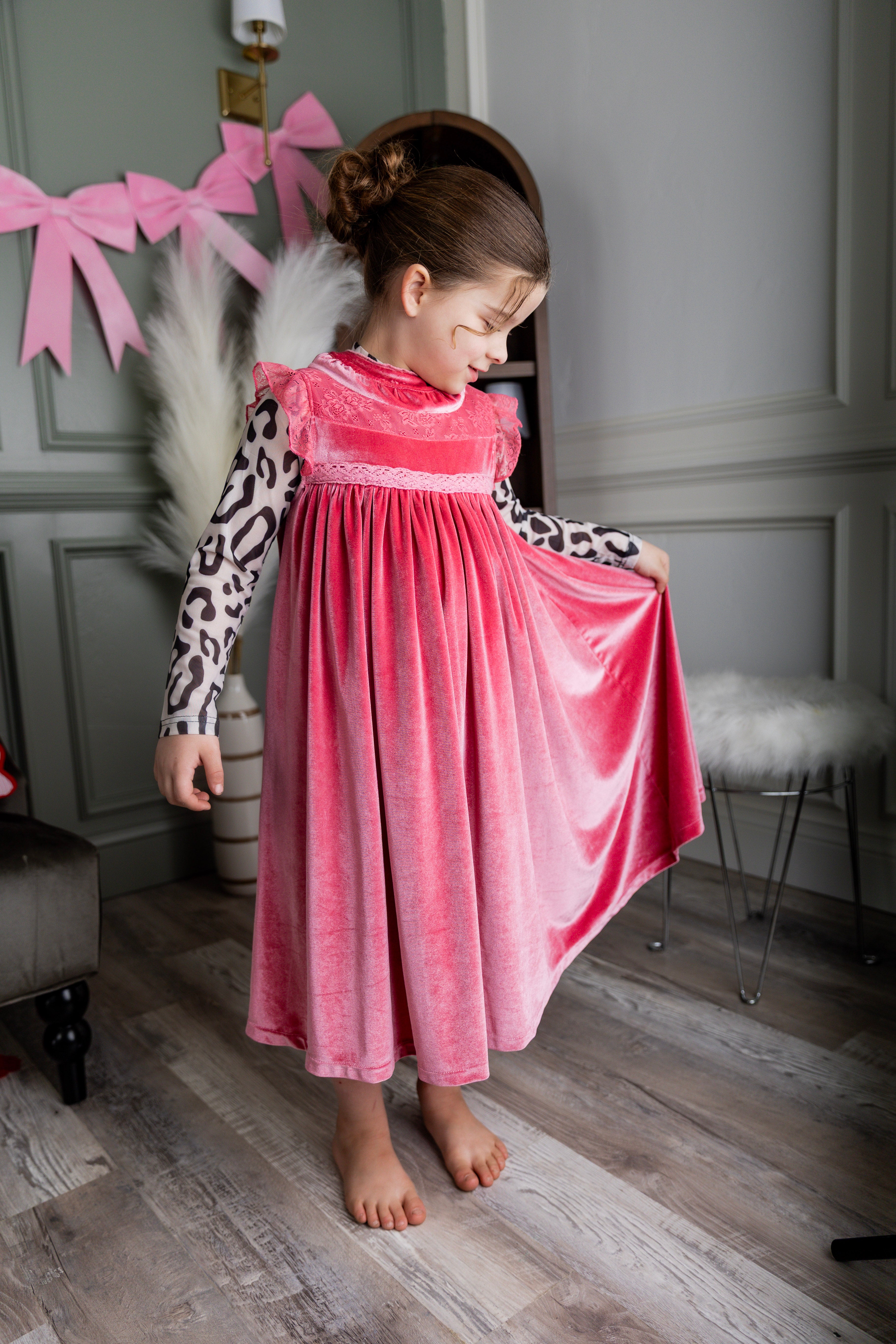 Model wearing Nuggles® Girls' Mesh Tee in Snow Leopard