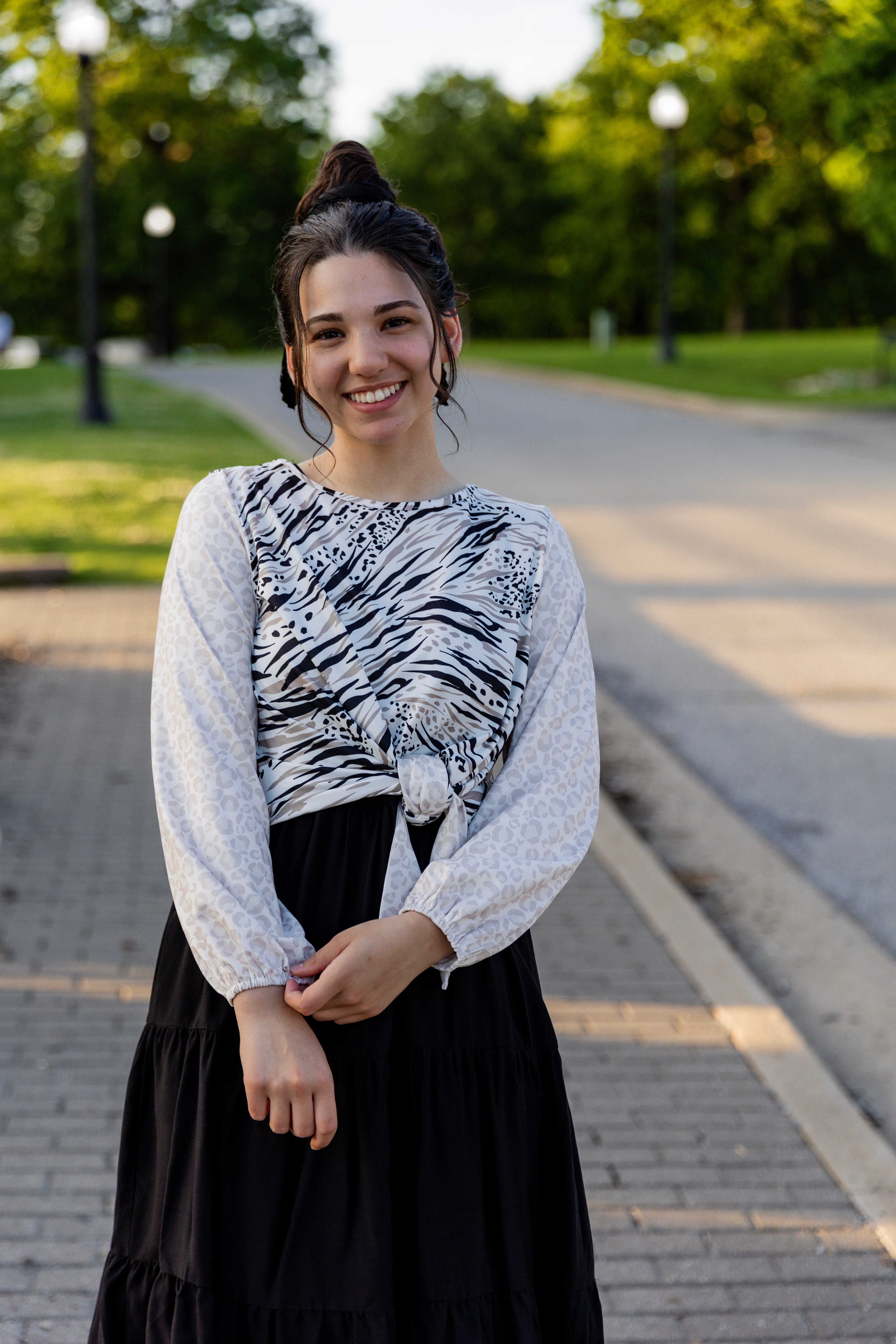 modest long sleeve top with a tie knot and contrasting knit fabrics