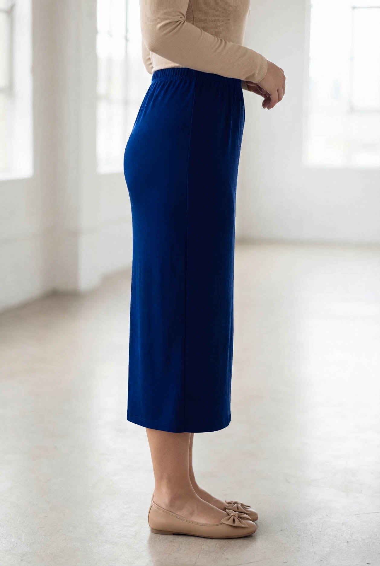Model wearing Nuggles® 31" Classic Skirt in Dark Royal