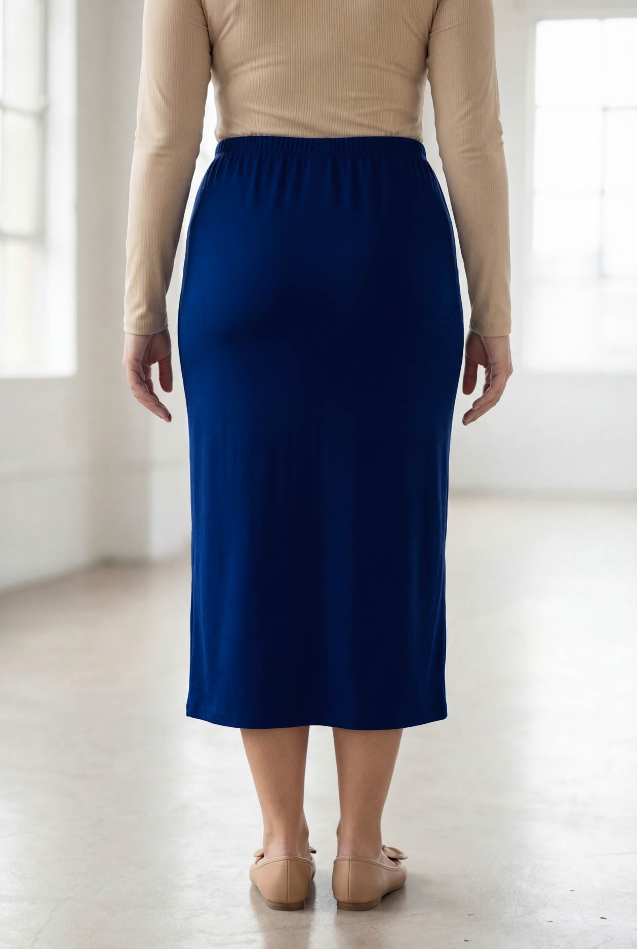 Model wearing Nuggles® 31" Classic Skirt in Dark Royal