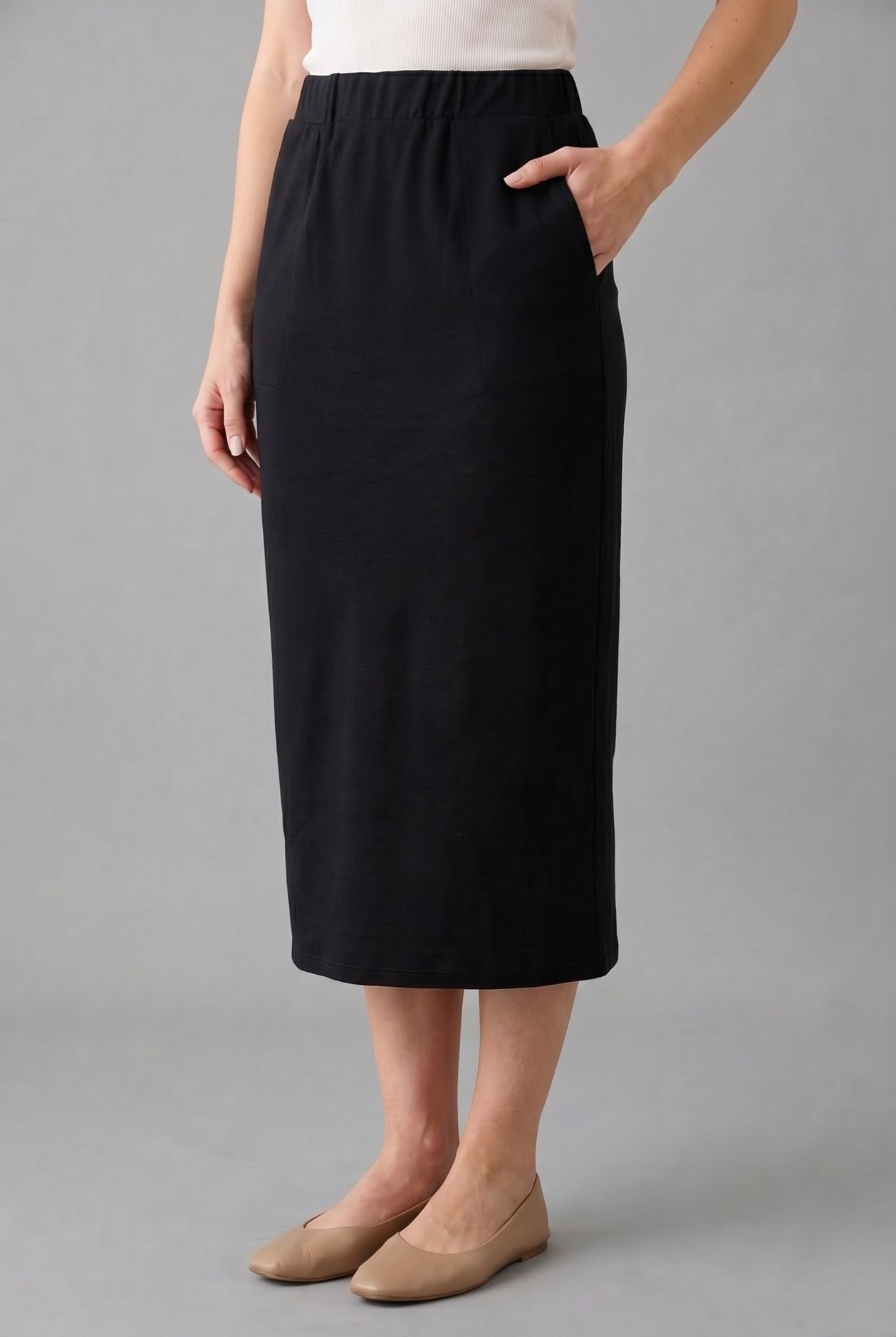 Model wearing Nuggles® 31" Pocket Classic Skirt in Black
