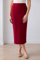 Model wearing Nuggles® 31" Pocket Classic Skirt in Dark Brick
