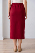 Model wearing Nuggles® 31" Pocket Classic Skirt in Dark Brick