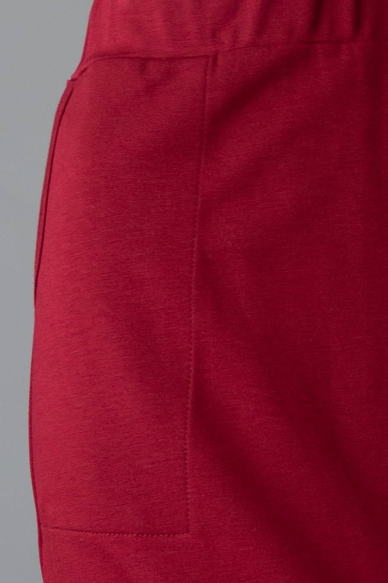 Model wearing Nuggles® 31" Pocket Classic Skirt in Dark Brick