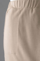 Model wearing Nuggles® 31" Pocket Classic Skirt in Khaki