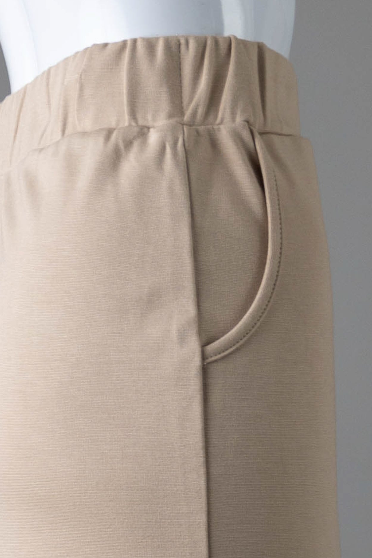 Model wearing Nuggles® 31" Pocket Classic Skirt in Khaki