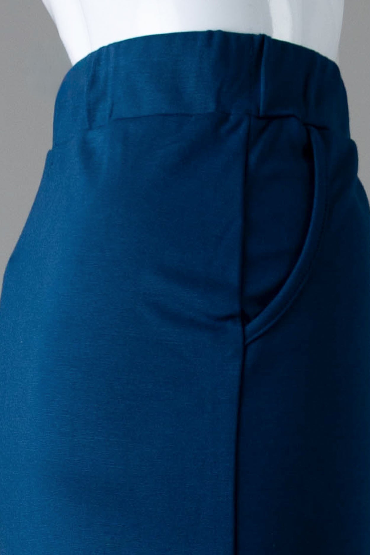 Model wearing Nuggles® 31" Pocket Classic Skirt in Peacock Blue