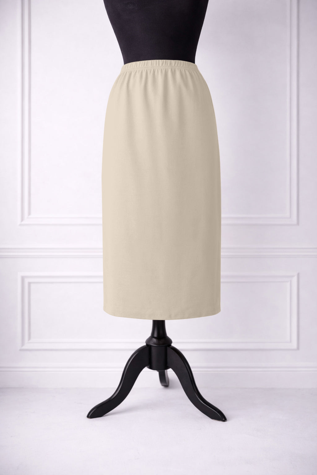 Stock photo of our Nuggles® 31-inch classic skirt elastic waistband and straight silhouette in Nude