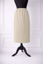 Stock photo of our Nuggles® 31-inch classic skirt elastic waistband and straight silhouette in Nude