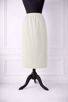 Stock photo of our Nuggles® 31-inch classic skirt elastic waistband and straight silhouette in Off White