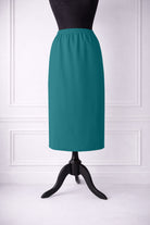 Stock photo of our Nuggles® 31-inch classic skirt elastic waistband and straight silhouette in Teal