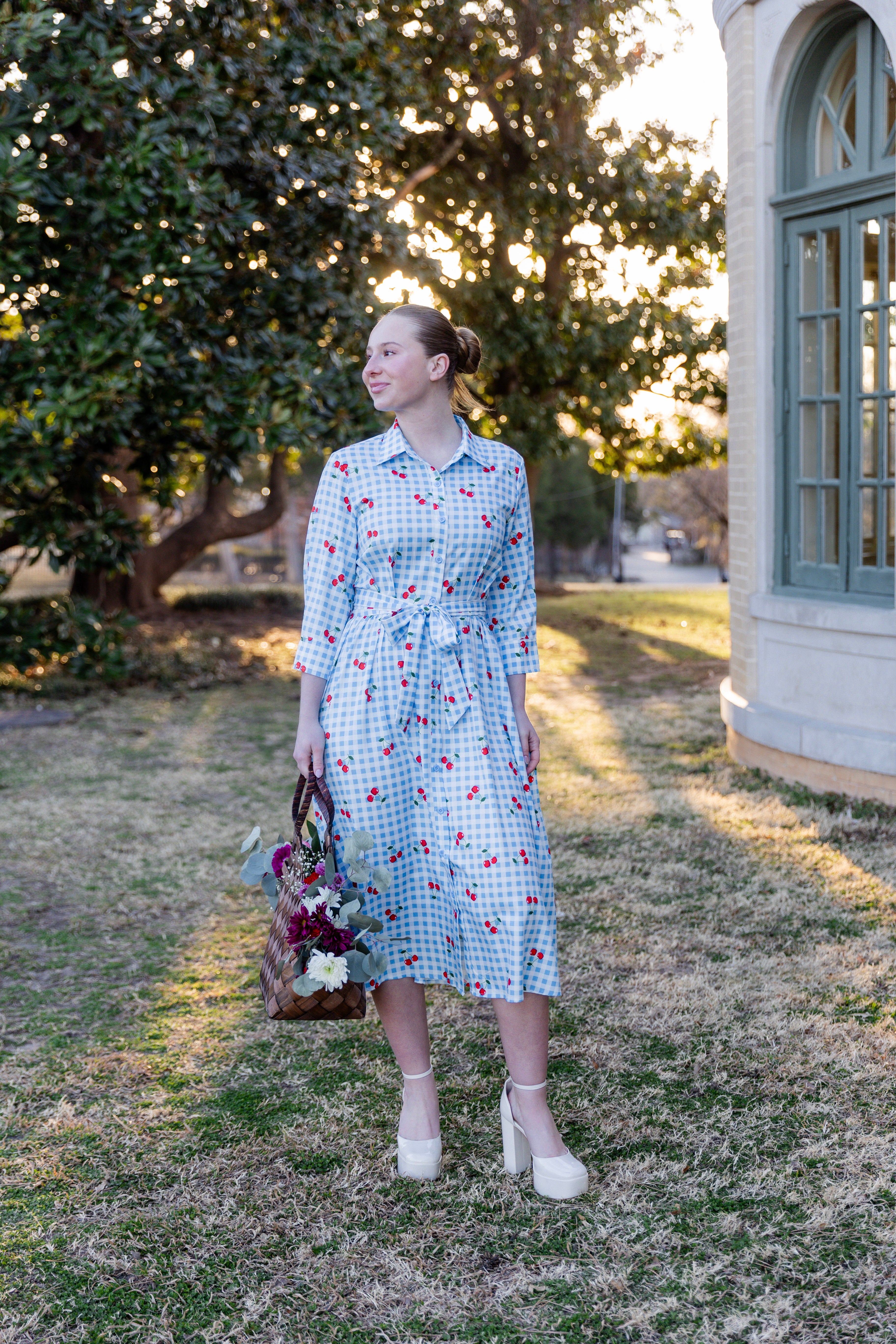 Model wearing the Nuggles® Rachel Dress in Sweet Cherry Check