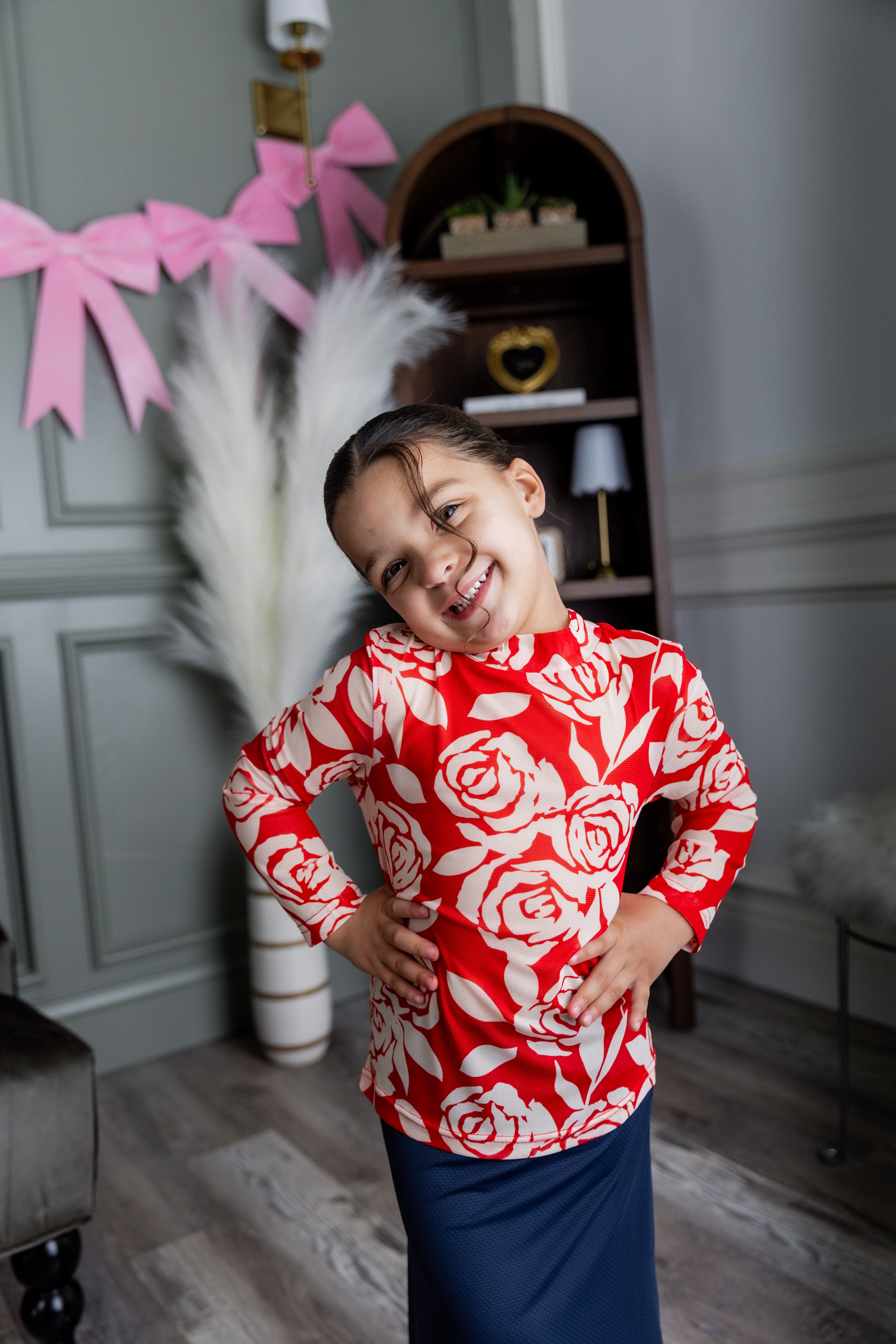 Model wearing Nuggles® Girls' Mesh Tee in Rosie Rouge