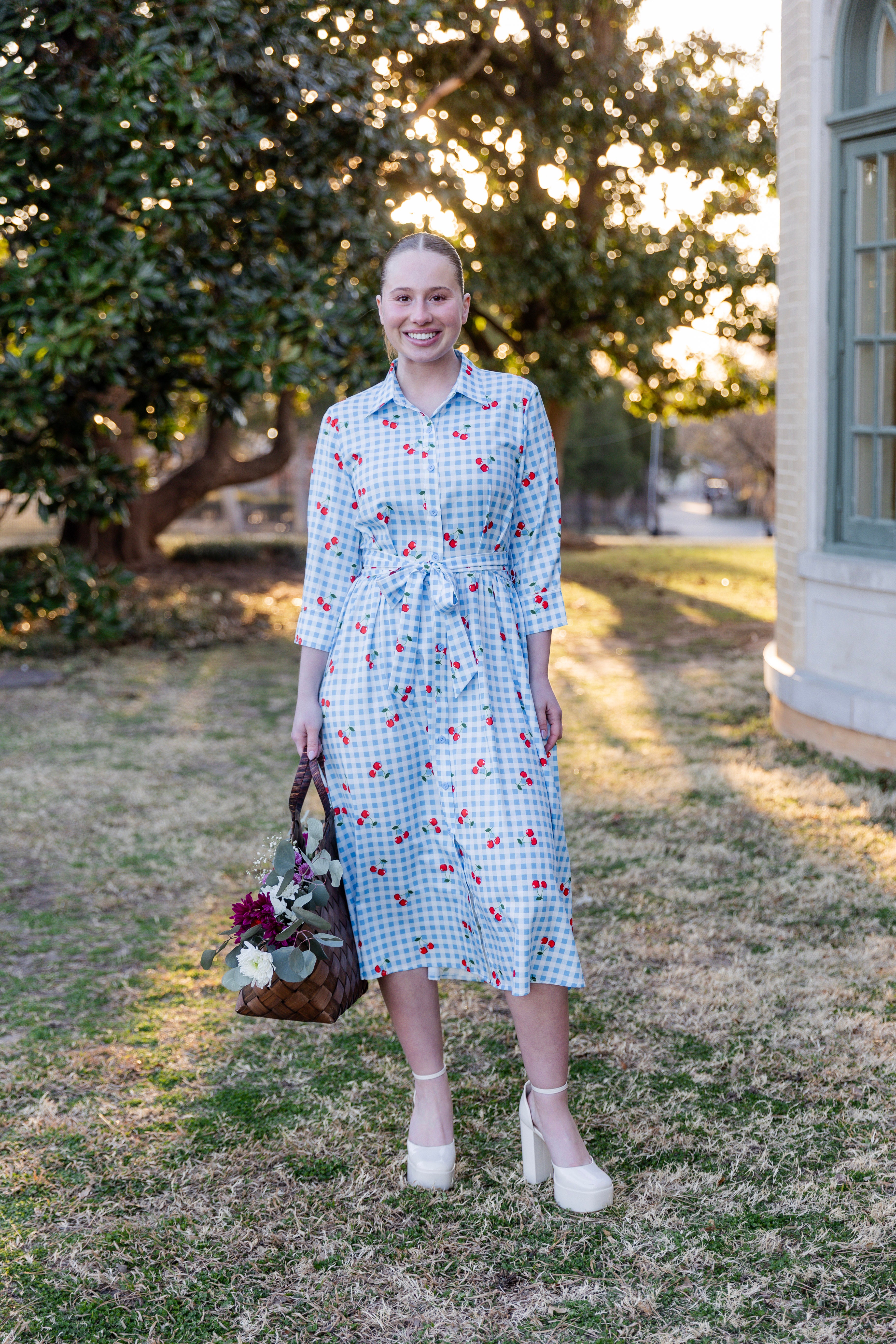 Model wearing the Nuggles® Rachel Dress in Sweet Cherry Check